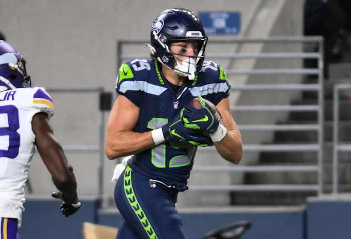 Seattle Seahawks wide receiver Jake Bobo (19) runs the ball in for a touchdown past Minnesota Vikings cornerback Andrew Booth Jr. (23) during the second half at Lumen Field.